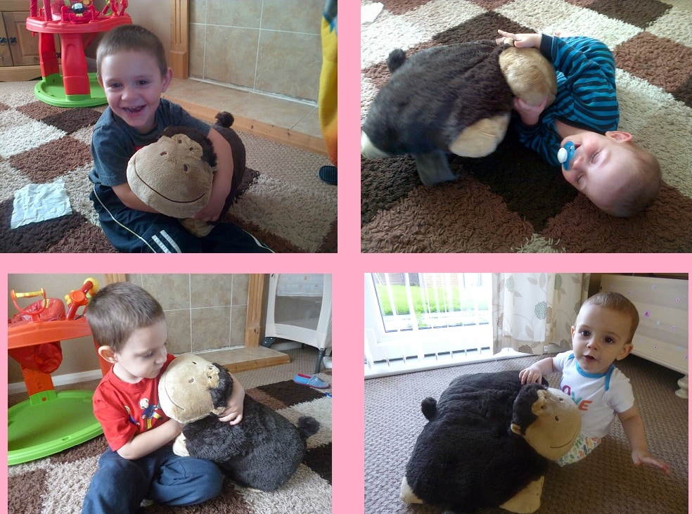 Four images of young children playing indoors with a large, brown Pillow Pet that resembles a bear. Each child is either hugging, holding, or lying with the soft toy on a patterned carpet.