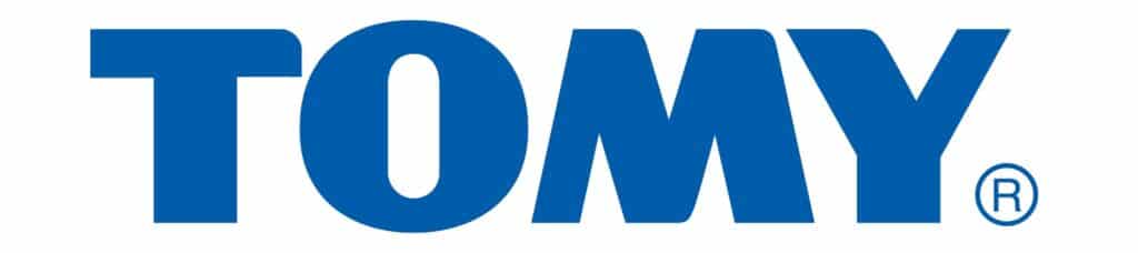 The image displays the TOMY logo, with the brand name "TOMY" in bold, blue uppercase letters on a white background. A registered trade mark symbol (®) is near the bottom right of the "Y," highlighting their Dinosaur Train InterAction Figures line.