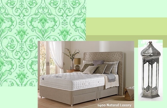 A new bedroom featuring a beige upholstered bed, green patterned wallpaper, large windows with white curtains, and a silver decorative lantern. The modern design embraces natural luxury accents for a perfect spring bedroom refreshment.