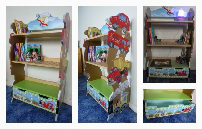 A colourful, cartoon-themed wooden bookcase for children featuring cars, a fire engine, train, and clouds—offering plenty of room to grow as books and toys are displayed on its shelves and shown from multiple angles on a blue carpet.