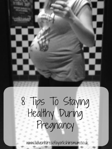 A pregnant woman takes a mirror selfie in a tiled bathroom. The text over the image reads, "8 Pregnancy Tips for Staying Healthy During Pregnancy www.adventuresofyorkshiremum.co.uk".