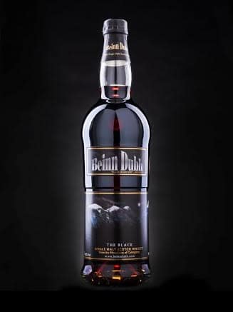 A dark glass bottle of Beinn Dubh single malt Scotch whisky, labelled "The Black," is shown against a black background. The label features mountainous imagery and gold text—making it a stand-out choice for Christmas gifts for men.