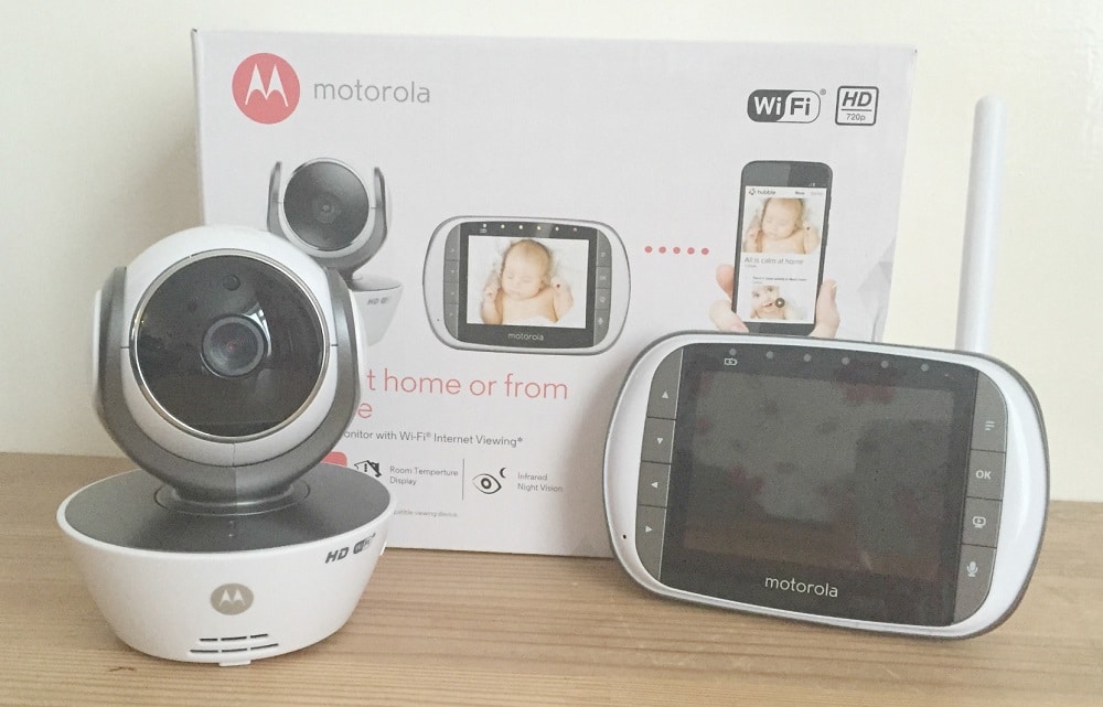 A Motorola MBP853 Baby Monitor set with a camera and monitor screen is displayed in front of its packaging, which highlights features like Connect WiFi and HD 720p.