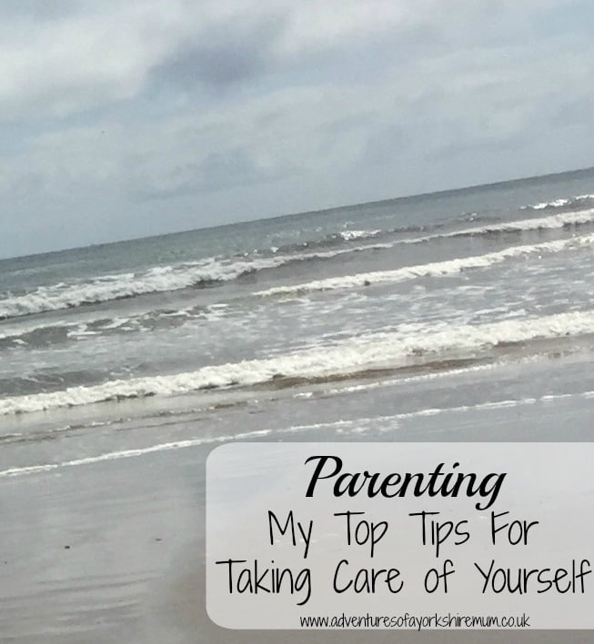 A cloudy beach scene with gentle waves rolling onto the shore. Overlaid text reads: "Parenting Tips: My Top Self-Care Strategies www.adventuresofyorkshiremum.co.uk".