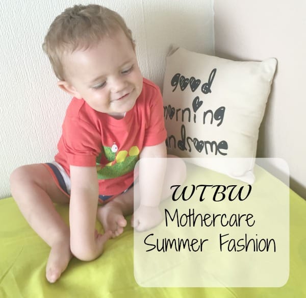 A smiling toddler in a red T-shirt and shorts sits on a lime green bed next to a cushion that reads "good morning handsome." Text overlay says, "WTBW Mothercare Summer Fashion collection.
