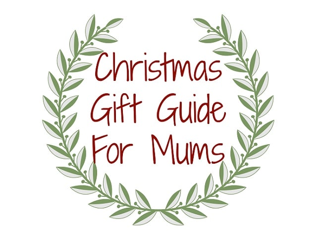 A green leafy wreath frames the words "Christmas Gift Guide For Mums" in red handwritten-style text on a white background, perfect inspiration for finding Christmas gifts for mums.