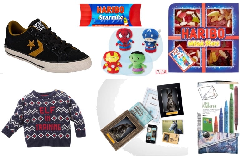 A collage featuring gift ideas for younger boys: a black Converse trainer, Haribo Starmix and Mega Stars sweet packs, Marvel soft toys, a navy “Elf in Training” jumper, art supplies, and framed art prints.