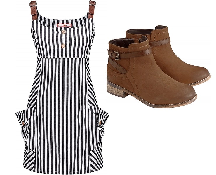 A black and white vertically striped sleeveless dress with front buttons and side pockets, styled for a chic Spring Look, paired with brown ankle boots featuring buckles and low heels, displayed on a plain white background.
