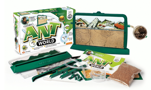 A children’s Ant World science kit with a display case showing tunnels, a bag of sand, tubing, magnifier, tools, and Bug Safari-themed packaging featuring pictures of ants and educational illustrations.