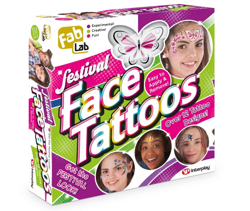 A colourful box labelled "FabLab Festival Face Tattoo Set" features smiling girls with face tattoos, a butterfly graphic, and text promoting 12 tattoo designs, easy application and removal, and a chance to win the ultimate festival look.