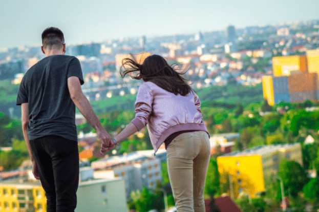 A couple looking out over a city