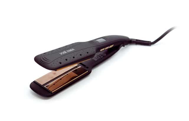 A black electric hair straightener with ceramic plates is shown open on a white background, perfect for a Mother’s Day prize bundle, with its power lead extending to the right.