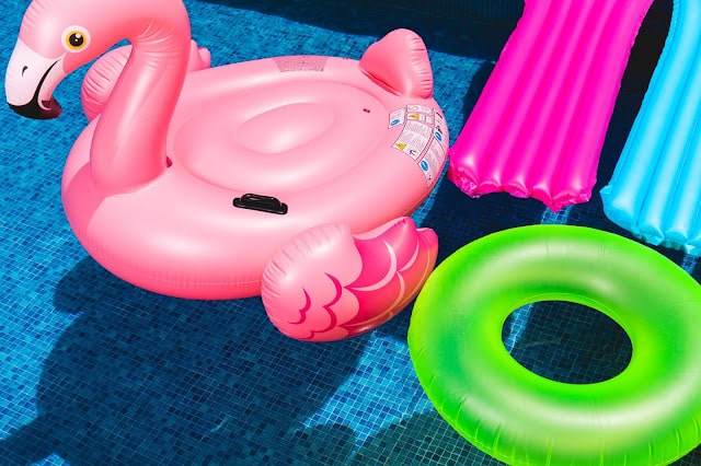 inflatables in a pool in the summer
