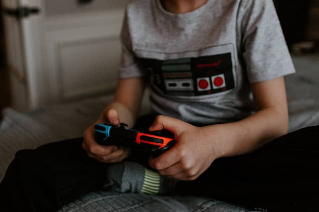 A boy playing on a Nintendo Switch
