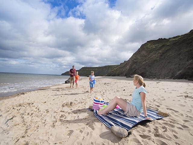 A family sat on the beach