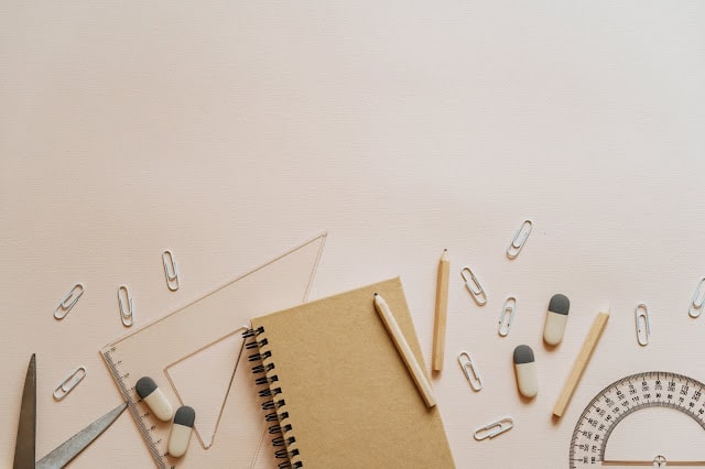 Stationery items including a maths set, erasers and pens