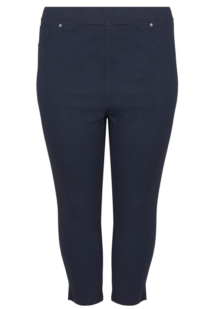 Your clothing essential: Navy blue, ankle-length, pull-on trousers with a slim fit; features faux front pockets and small metallic rivets at the waist.