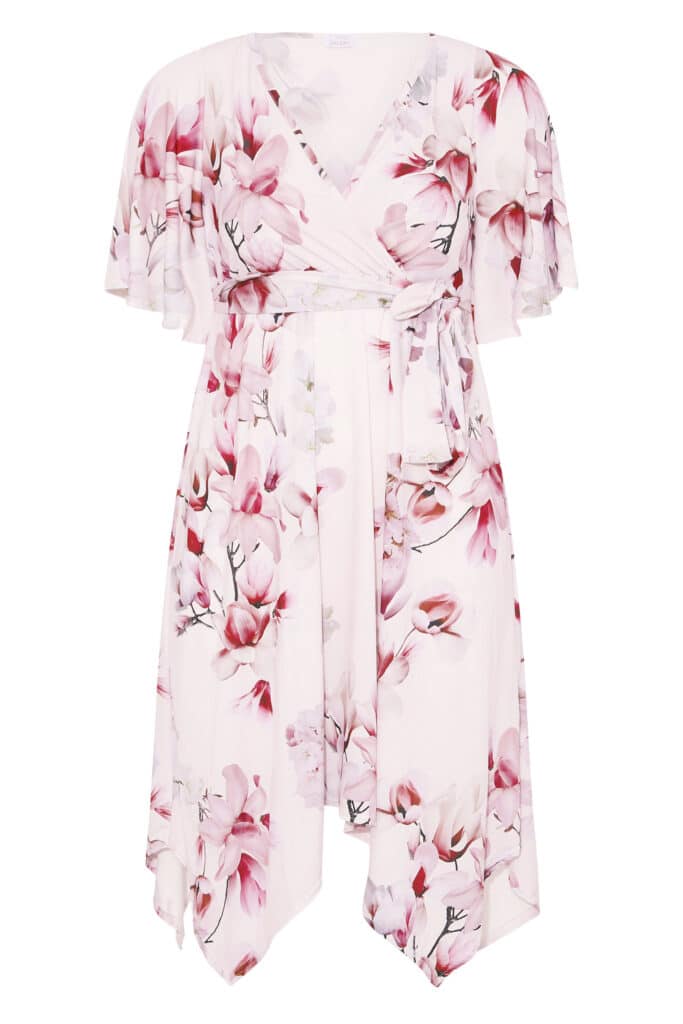 Your clothing collection shines with this light pink floral wrap dress, featuring short flutter sleeves, a tie waist, and an asymmetrical hem in soft fabric adorned with large pink and white flowers plus green accents.
