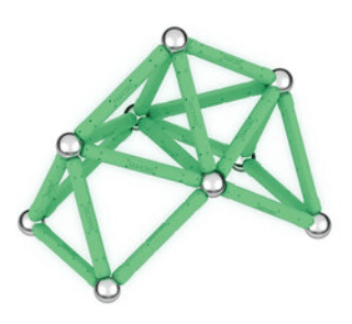 A geometric structure made of green Geomag Glow magnetic rods and silver metal spheres, forming a 3D triangular and polygonal shape.