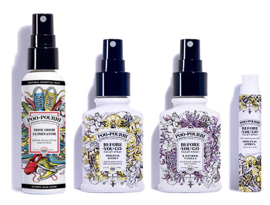 Five Poo-Pourri toilet spray bottles of various sizes are lined up. Each Poo-Pourri bottle features a decorative label, with designs like flowers and scrollwork, and the product names are visible on the front.