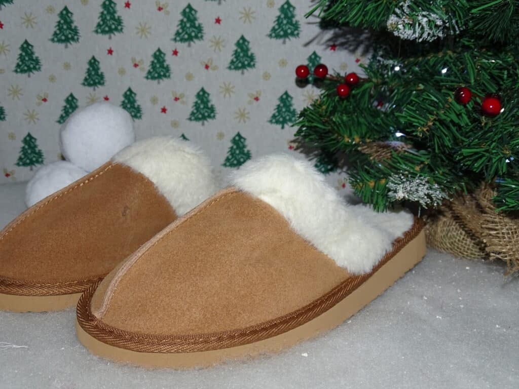 A pair of light brown mule slippers