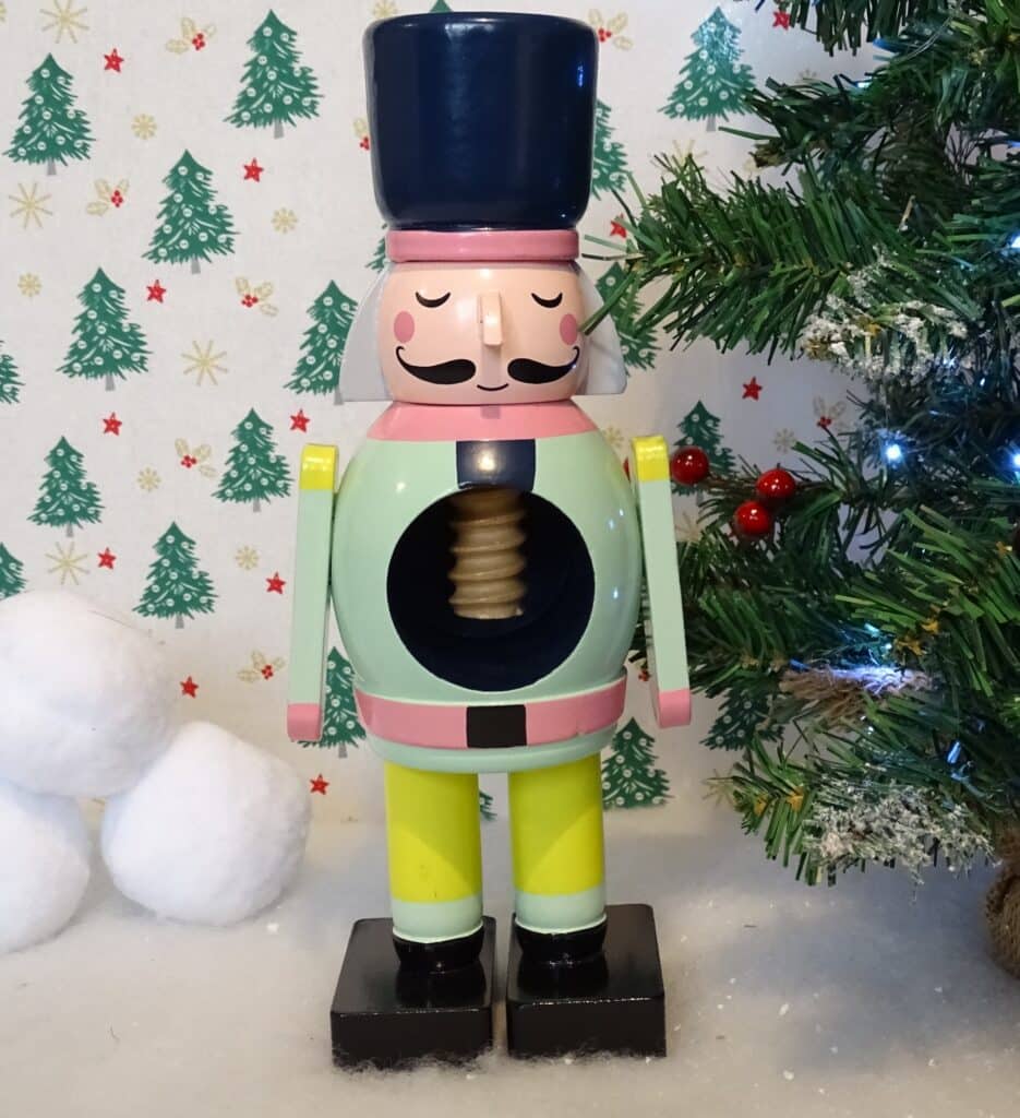 A wooden nutcracker soldier that can be used for cracking nuts or as an ornament