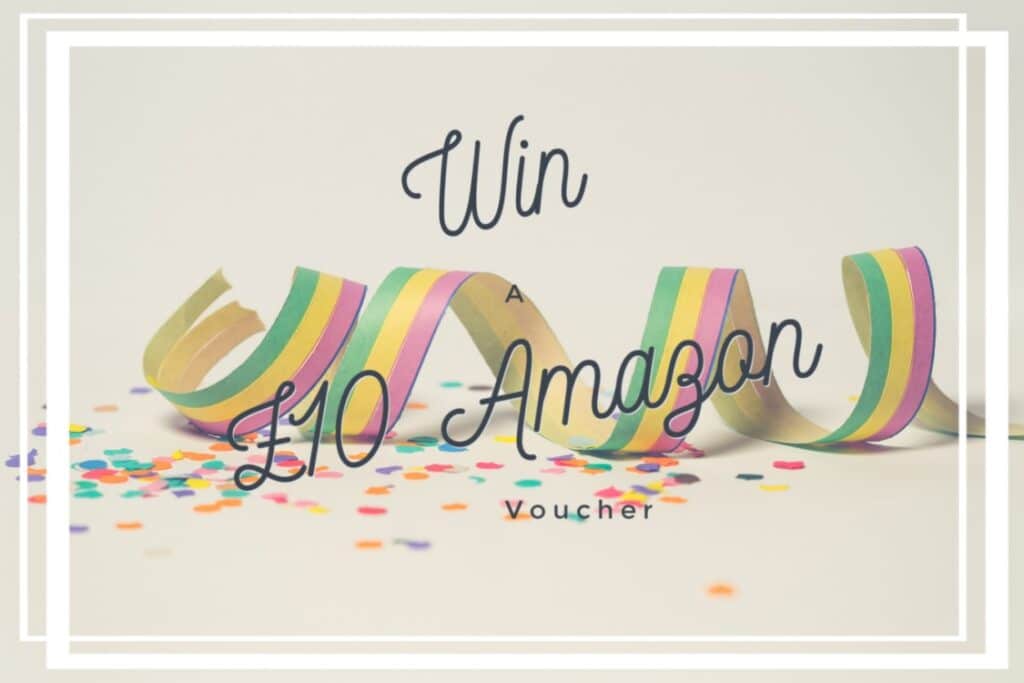 Colourful party streamers and confetti surround the elegant script text overlay: "Win A £10 Amazon Voucher," all beautifully framed by crisp white borders.