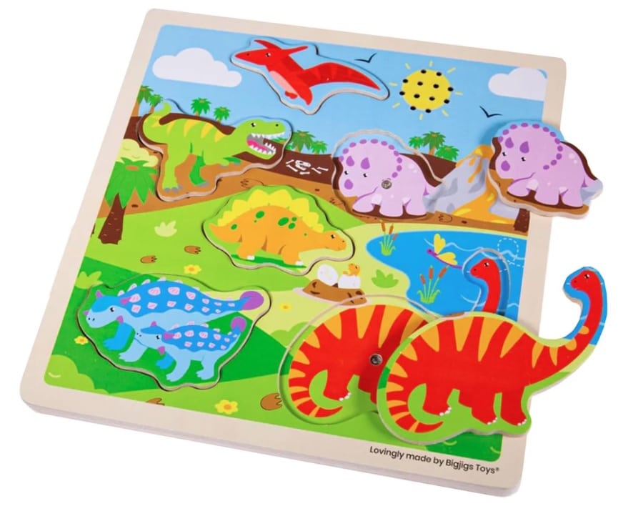 A colourful wooden dinosaur puzzle for children, featuring five removable pieces shaped like dinosaurs, set in a bright prehistoric landscape with a sun, trees, and a pond. A must-have for Unicorn and Dinosaur toys lovers!.