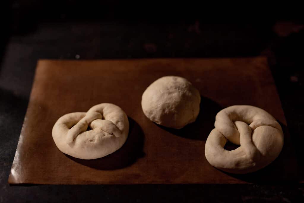 Homemade pretzels sat ready to be baked in an oven