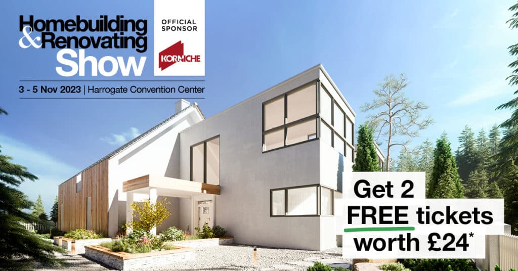 Modern white house with large windows surrounded by trees under a blue sky. Discover more at the Northern Homebuilding & Renovating Show, 3–5 Nov 2023 at Harrogate Convention Centre. Claim your 2 free tickets worth £24.