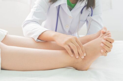 A doctor examining a womans foot for possible common foot problems