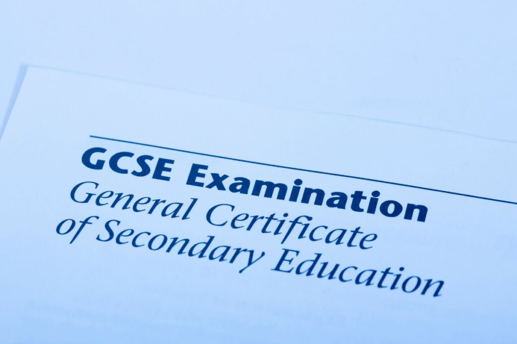 A close-up of a document titled "GCSE Examination: General Certificate of Secondary Education" on a white background, highlighting the official GCSE certificate details.