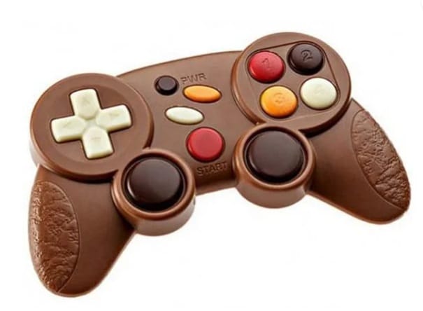 A perfect stocking filler, this video game controller is made entirely of chocolate with colourful sweet buttons and textured handles, set against a white background to mimic the look of a real controller.