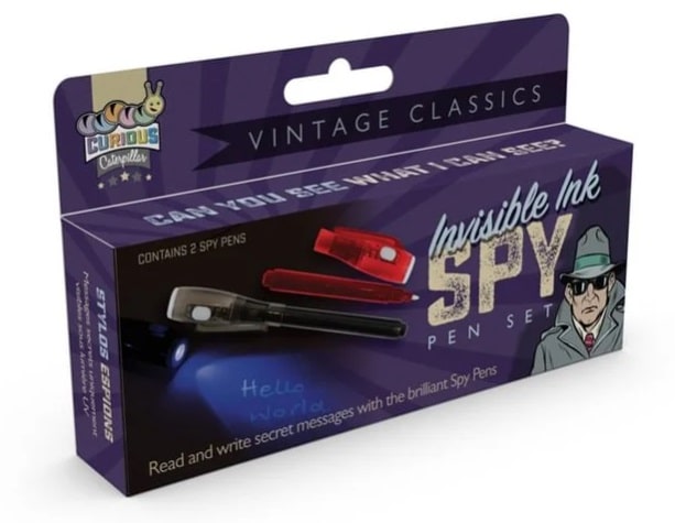 A perfect stocking filler, the "Invisible Ink Spy Pen Set" from Curious Caterpillar Vintage Classics features two spy pens, a secret message saying "Hello World," and a detective in a trench coat and hat on the box.