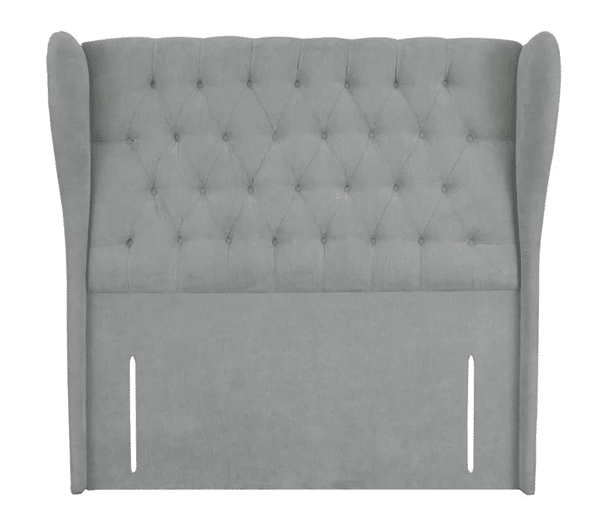 Light grey, upholstered bed headboard with wingback sides and button-tufted detailing on the upper portion; two vertical slots are visible near the bottom.