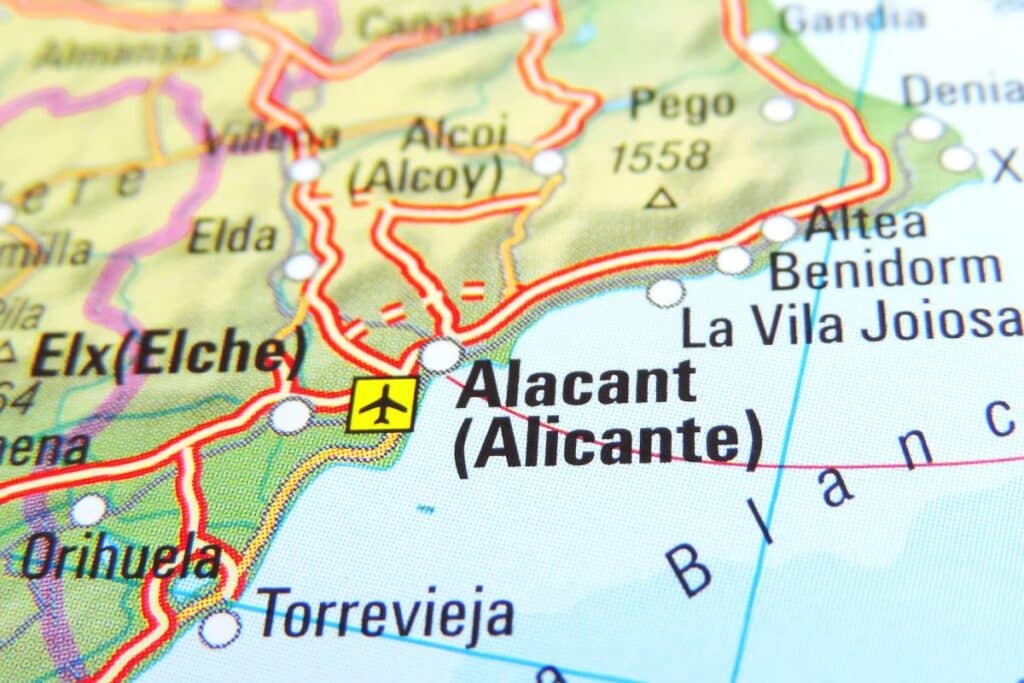 Close-up of a map showing the Alicante (Alacant) region in Spain, with nearby cities like Elx (Elche), Orihuela, Torrevieja, Benidorm, and an airport symbol near Alicante—ideal for those seeking a property solicitor along the visible coastline and roads.