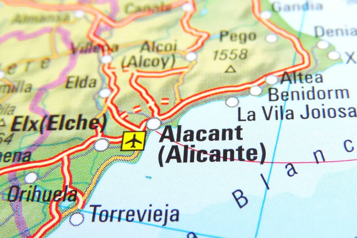 Close-up of a map showing the Alicante (Alacant) region in Spain, with nearby cities like Elx (Elche), Orihuela, Torrevieja, Benidorm, and an airport symbol near Alicante—ideal for those seeking a property solicitor along the visible coastline and roads.