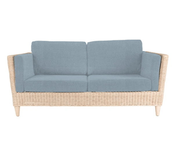 A stylish two-seater sofa with a light wicker frame and light blue cushioned seat, back, and armrests—perfect for adding comfort and charm to your conservatory. Shown on a white background.