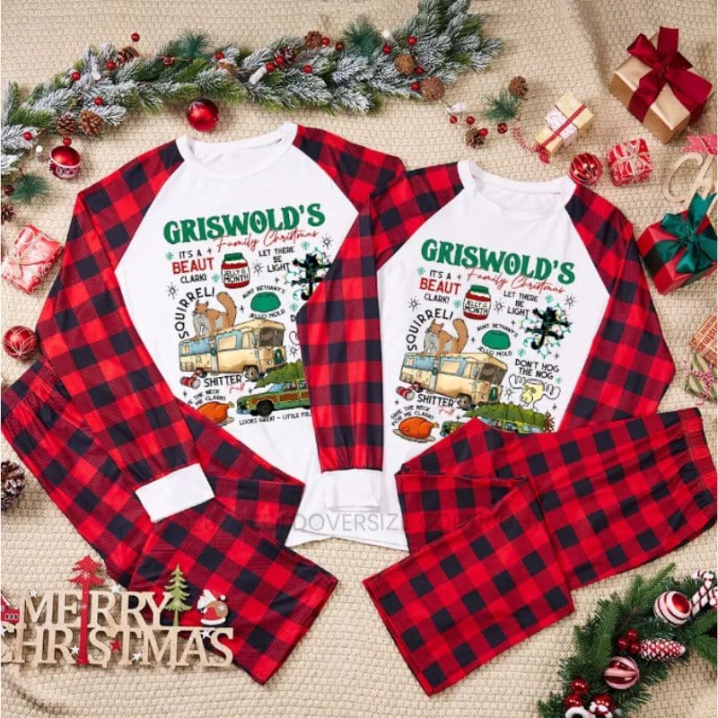 Two sets of matching red and black check Christmas pyjamas with bold oversize "Griswold's Family Christmas" shirts, surrounded by festive decor, ribbon, pine branches, baubles, wrapped presents, and a "Merry Christmas" sign.