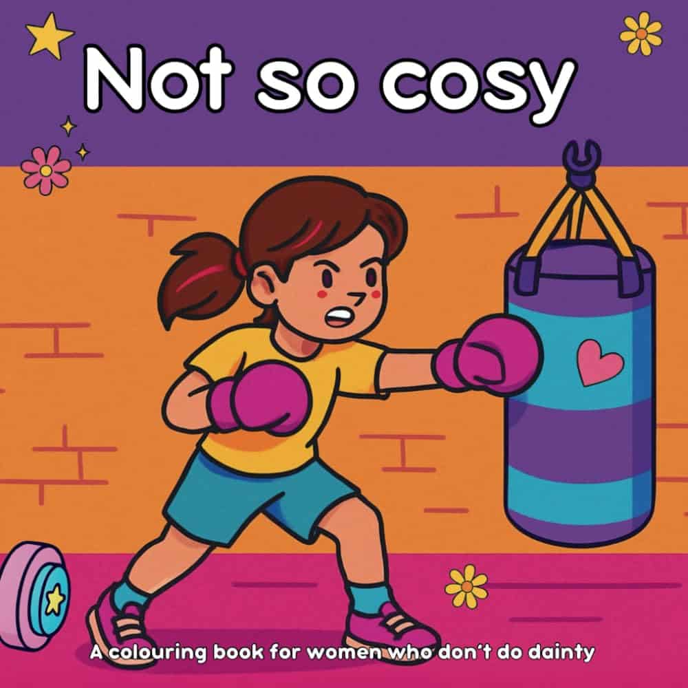 Illustration of a determined woman with brown hair boxing a blue punch bag, wearing pink gloves and sporty clothes. Text above reads “Not so cosy,” with a subtitle: “A colouring book for women who don’t do dainty.”.